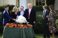 <p>President Donald Trump, center, with first lady Melania Trump, right, and their son Barron Trump, pardons Drumstick at the National Thanksgiving Turkey pardoning ceremony in the Rose Garden of the White House in Washington, Tuesday, Nov. 21, 2017. This is the 70th anniversary of the National Thanksgiving Turkey presentation. (Photo: Manuel Balce Ceneta/AP) </p>