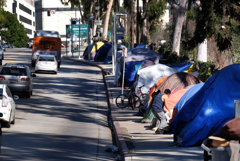 Tents from a homeless encampment line a street in downtown Los Angeles earlier this year.