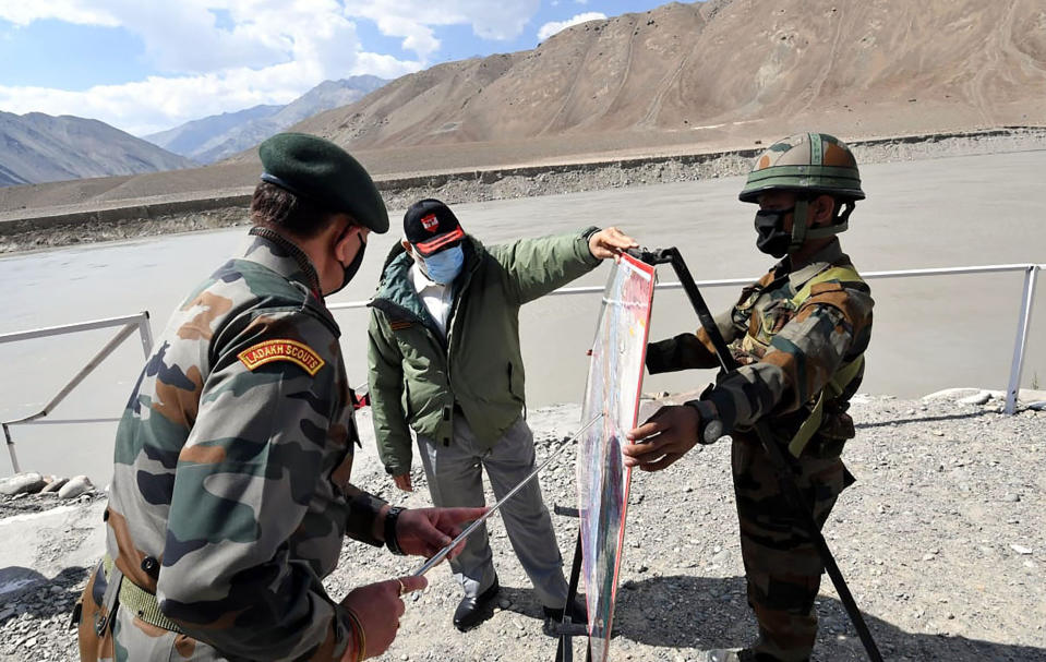 In this handout photo provided by the Press Information Bureau, Indian Prime Minister Narendra Modi interacts with soldiers during a visit to the Ladakh area, India, Friday, July 3, 2020. Modi made an unannounced visit Friday to a military base in remote Ladakh region bordering China where the soldiers of the two countries have been facing off for nearly two months. Modi’s visit comes in the backdrop of massive Indian army build-up in Ladakh region following hand-to-hand combat between Indian and Chinese soldiers on June 15 that left 20 Indian soldiers dead and dozens injured, the worst military confrontation in over four decades between the Asian giants. (Press Information Bureau via AP)