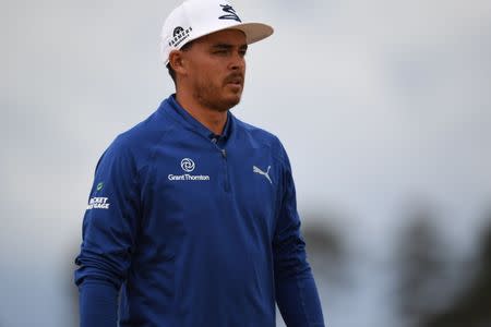 Jul 17, 2018; Carnoustie, Angus, SCT; Rickie Fowler walks off the 15th green during a practice round of The Open Championship golf tournament at Carnoustie Golf Links. Thomas J. Russo-USA TODAY Sports