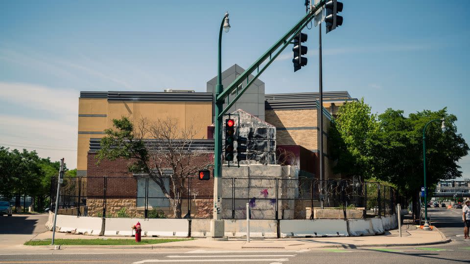 Exterior of the police department's 3rd Precinct in south Minneapolis that was burned by rioters in May of 2020. To this day it remains boarded up. Its officers are currently headquartered a few miles away downtown.  - Andrea Ellen Reed for CNN