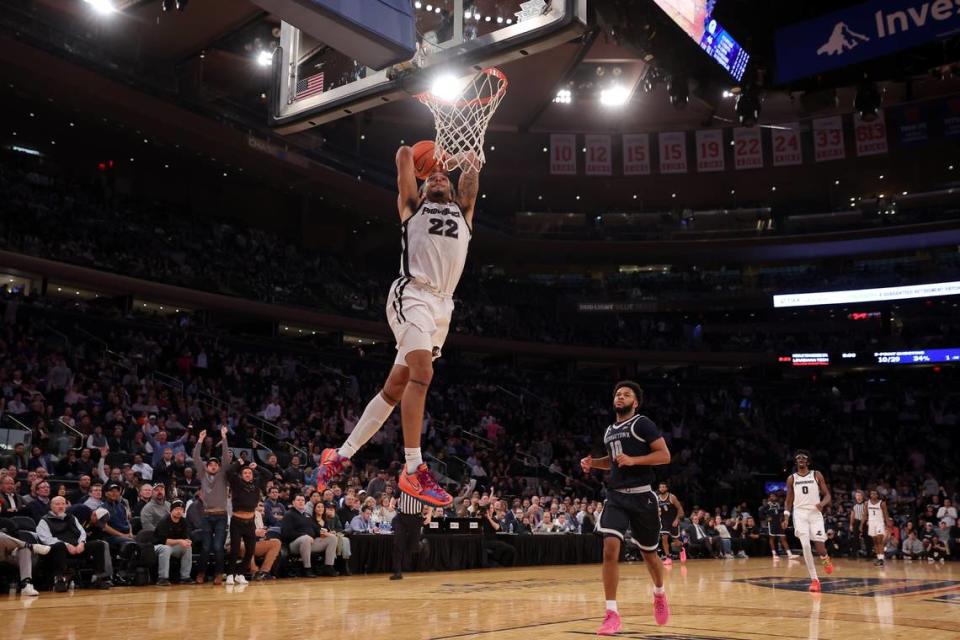 Providence Friars guard Devin Carter (22) dunks on a breakaway against Georgetown Hoyas guard Jayden Epps (10) during the second half March 13 at Madison Square Garden in New York City. The Kings selected Carter with the No. 13 pick in the 2024 NBA draft.