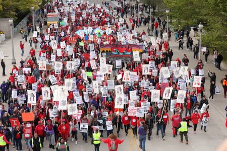 Teachers protest during a rally and march on the first day of a teacher strike in Chicago