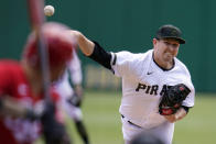 Pittsburgh Pirates starting pitcher Trevor Cahill delivers during the first inning of a baseball game against the Cincinnati Reds in Pittsburgh, Wednesday, May 12, 2021.(AP Photo/Gene J. Puskar)