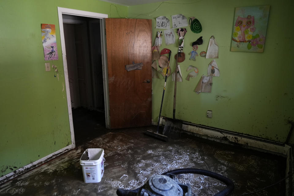 A child's muddy bedroom that had flooded is seen Wednesday, June 15, 2022, in Red Lodge, Mont. (AP Photo/Brittany Peterson)