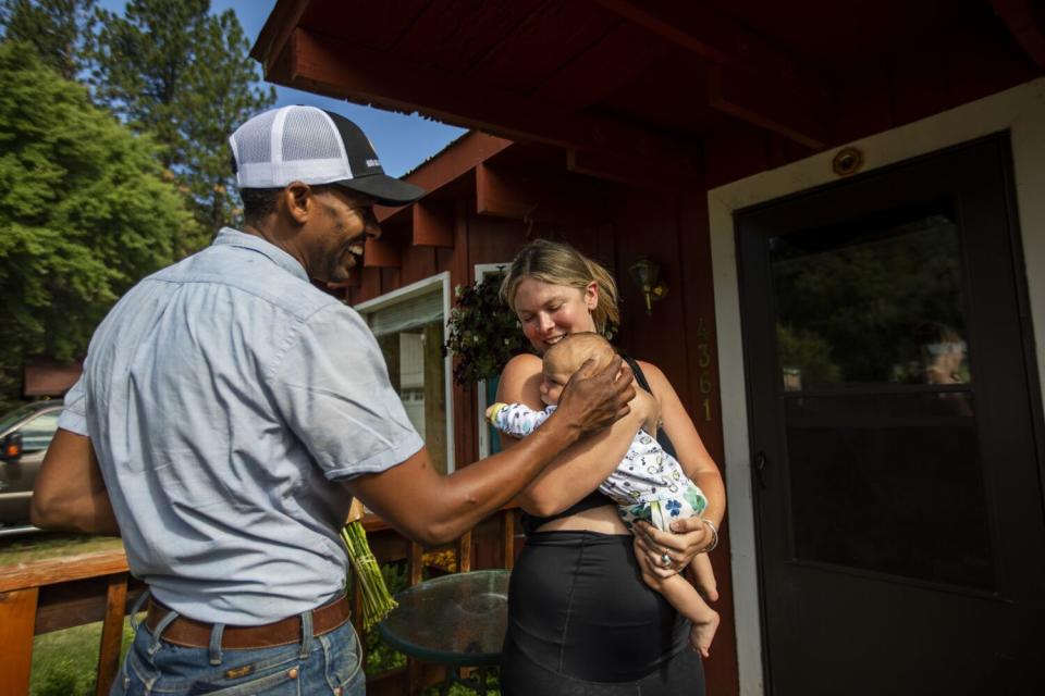 Andre Essue delivers fresh flowers from the back of his vehicle in Taylorsville.