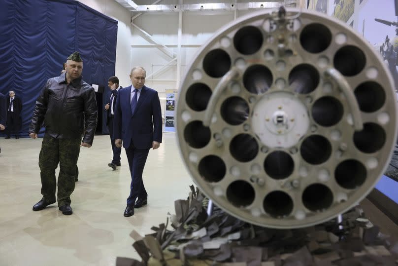 Vladimir Putin and Alexander Karamyshev the head of aerial weapons training and tactical training center visit a military facility in Torzhok, March 2024