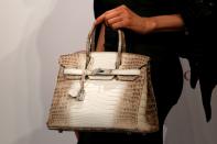 <p>One Himalayan crocodile leather Birkin bag ($396,751, the most expensive handbag ever), with some money leftover to buy more accessories. (Reuters) </p>