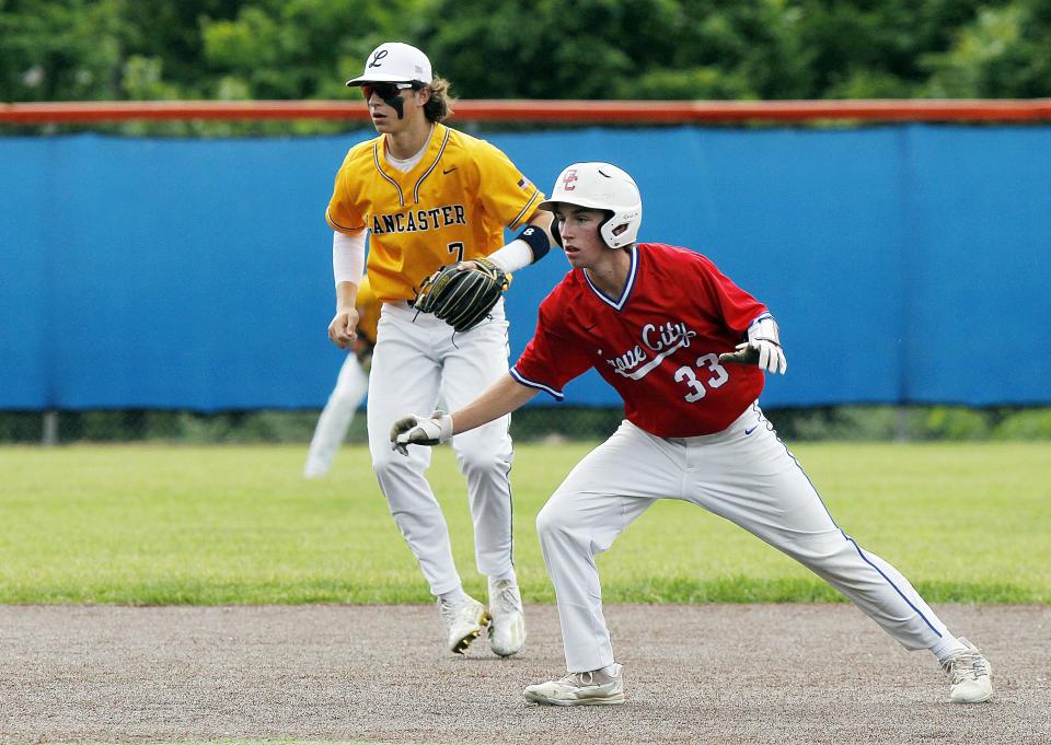 Grove City's Trent Ruffing takes a lead off second in front of Lancaster's Tony Falvo during a Division I district final at Olentangy Orange on May 26. The game was scoreless in the sixth inning when it was suspended because of rain. The Greyhounds won 2-0 on May 28 at Upper Arlington.