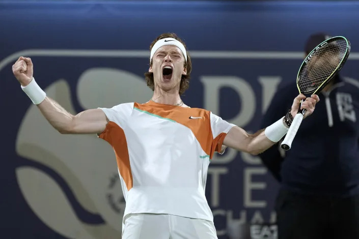 Russia's Andrey Rublev celebrates after defeating Poland's Hubert Hurkacz during a semifinal match of the Dubai Duty Free Tennis Championship in Dubai, United Arab Emirates, Friday, Feb. 25, 2022. (AP Photo/Ebrahim Noroozi)