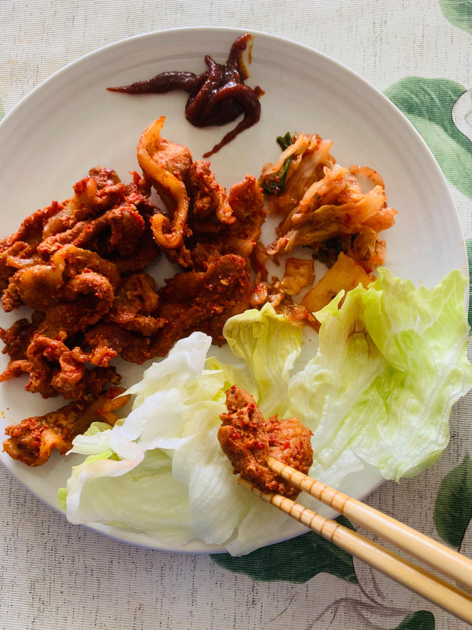 Preparing homemade Korean BBQ pork belly lettuce wraps.