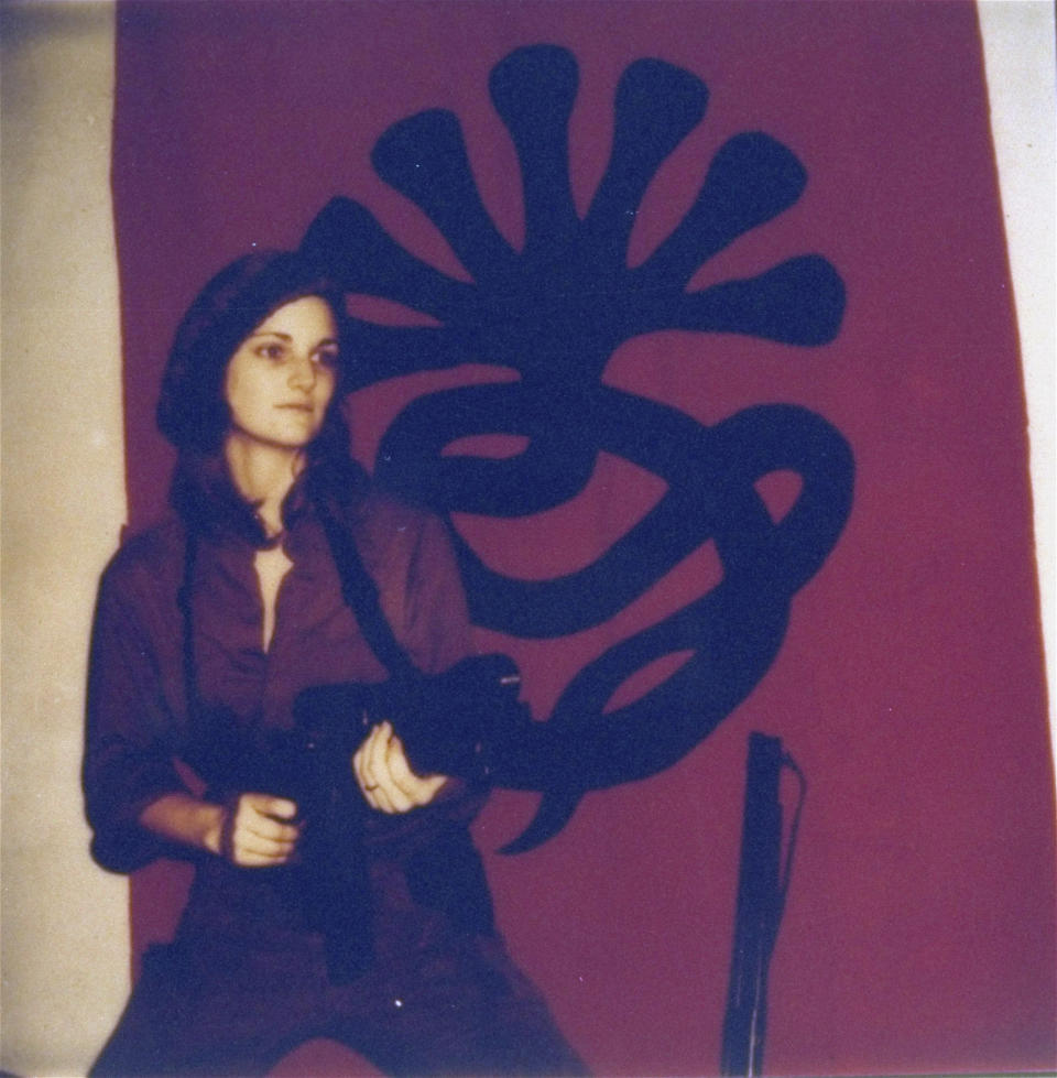 FILE - This poster issued by the Symbionese Liberation Army shows Patricia “Patty” Hearst, as "Tania", holding a machine gun. The newspaper heiress was kidnapped at gunpoint 50 years ago Sunday, Feb. 4, 2024, by the little-known armed revolutionary group. The 19-year-old college student's infamous abduction in Berkeley, Cali., led to Hearst joining forces with her captors for a 1974 bank robbery that earned her a prison sentence. Hearst, granddaughter of wealthy newspaper magnate William Randolph Hearst, will turn 70 on Feb. 20. (AP Photo/File)