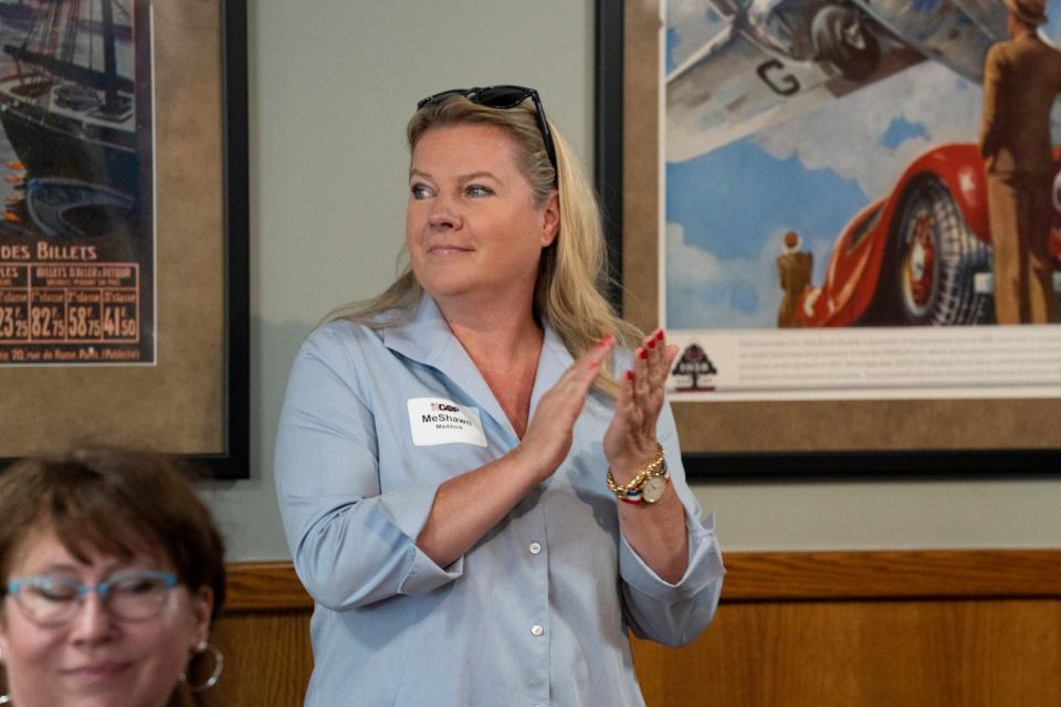 Michigan GOP co-chair Meshawn Maddock claps as members of the Kalamazoo County Republicans meet at Traveler's Cafe and Pub in Portage during a luncheon on June 10, 2021. The keynote speaker of the event was Maddock.