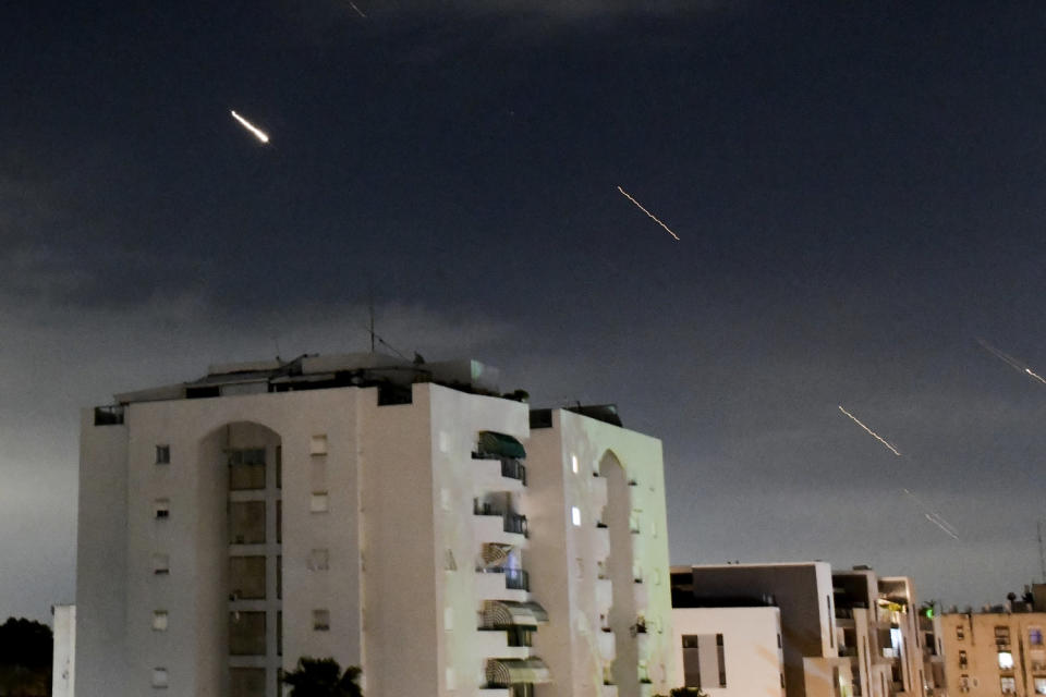 The Israeli Iron Dome air defense system launches in central Israel to intercept missiles fired from Iran over the weekend. (Tomer Neuberg / AP)