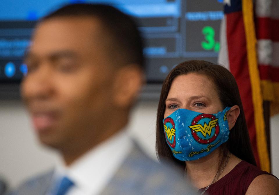 Montgomery Mayor Steven Reed speaks as city EMA Director Christina Thornton looks on during a news conference Wednesday in Alabama's capital.