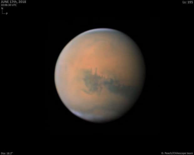 This image illustrates the planet-wide dust storm enveloping Mars in June 2018. Due to the storm, Mars appeared dimmer than normal in the night sky. (Submitted by Damian Peach - image credit)