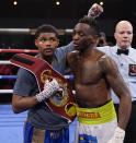 Shakur Stevenson, left, and Jeremiah Nakathila, of Namibia, embrace after Stevenson won thier WBO interim junior lightweight title fight Saturday, June 12, 2021, in Las Vegas. (AP Photo/John Locher)