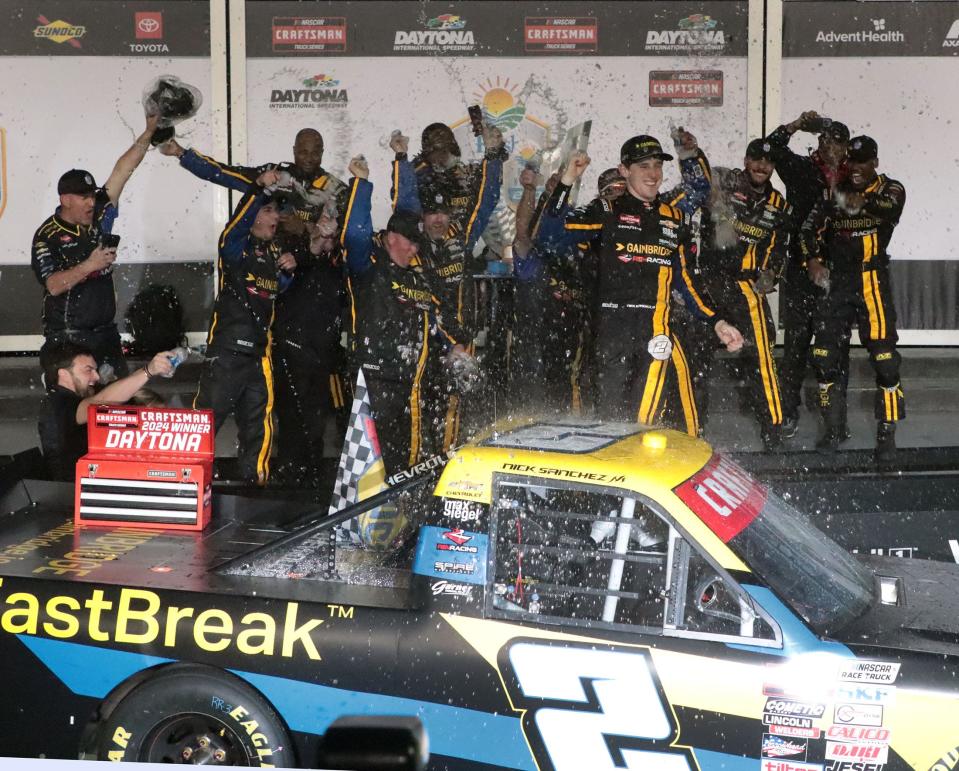 Nick Sanchez climbs out of his No. 2 Chevrolet in Victory Lane, Friday night February 16, 2024, after winning the Fresh From Florida 250 at Daytona International Speedway.