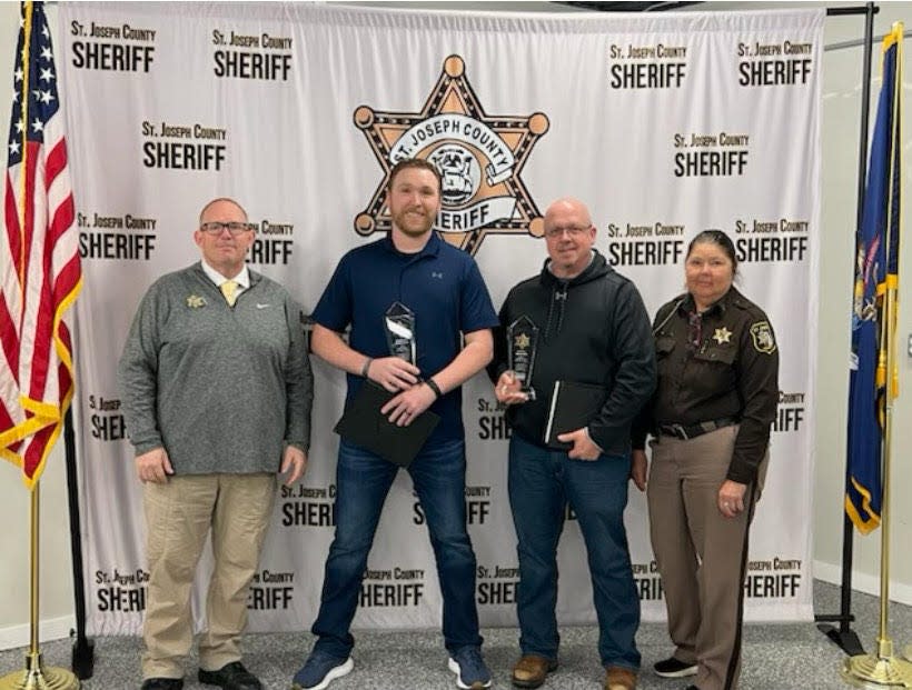 Spencer Schrader and Paul Kindig, with Undersheriff Jason Bingaman on the left and Capt. Kitty Buchner on the right, were named corrections deputies of the year, an accolade chosen by their sergeants.