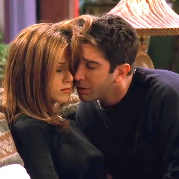 Jennifer Aniston and David Schwimmer snuggling in "Friends"