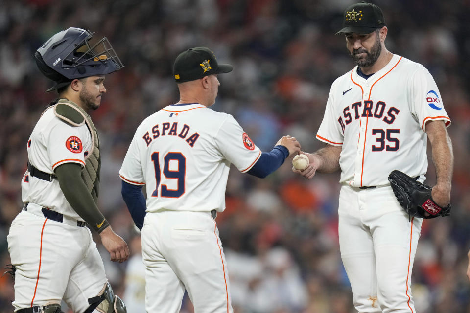 Houston Astros starting pitcher Justin Verlander (35) is removed from the game by manager Joe Espada (19) during the fifth inning of a baseball game against the Milwaukee Brewers, Saturday, May 18, 2024, in Houston. (AP Photo/Eric Christian Smith)