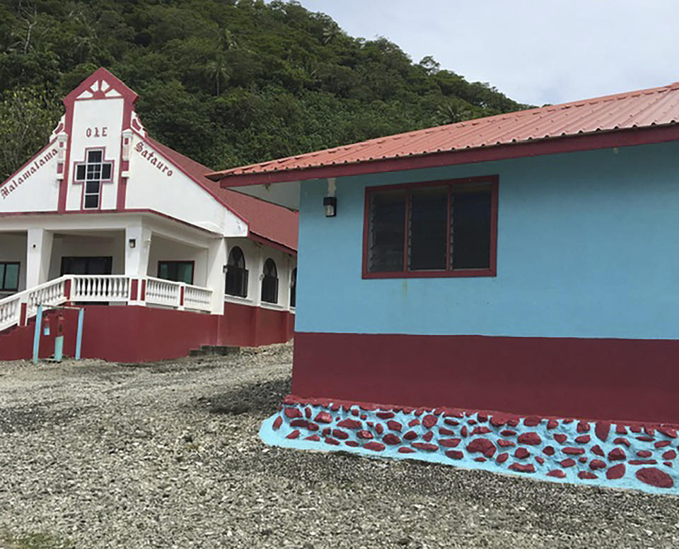 This Feb. 5, 2020 photo provided by Tisa Fa'amuli shows church buildings on Tutuila, the largest island in the American Samoa archipelago. Many residents of American Samoa are concerned that a federal judge's recent ruling in Utah, saying those born in the U.S. territory should be recognized as U.S. citizens, could threaten "fa'a Samoa," the Samoan way of life, which includes cultural traditions like prayer curfews, communal living and a belief that the islands' lands should stay in Samoan hands. (Tisa Fa'amuli via AP)