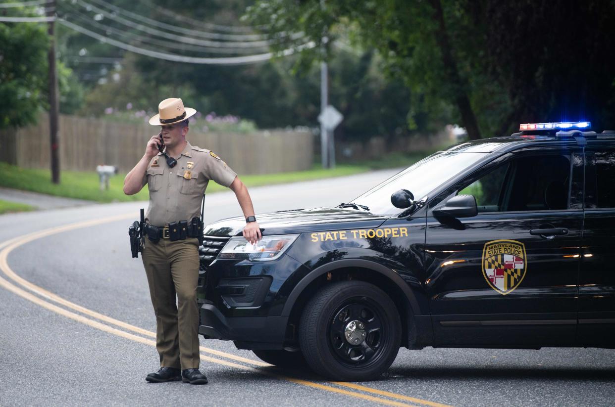 Police block off roads near the location of a shooting in Aberdeen, Maryland, in September. Aberdeen police recently completed an investigation related to a school shooting threat at Aberdeen Middle School, determining it was a hoax. Two students have been charged.