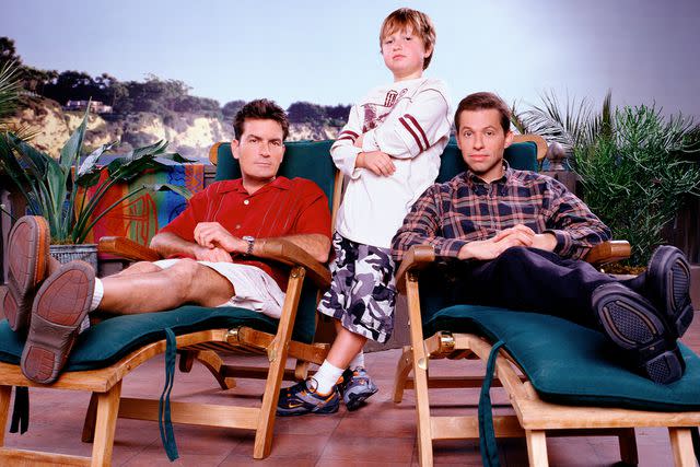 <p>Cliff Lipson/CBS via Getty</p> Charlie Sheen (left), Jon Cryer (right), and Angus T. Jones (middle) — "Two and a Half Men"