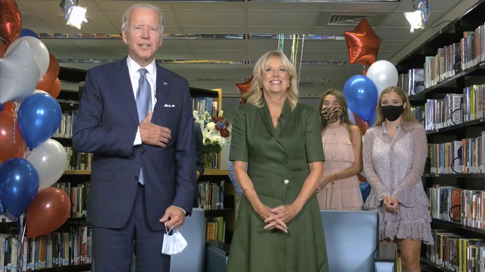 In this image from video, Democratic presidential candidate former Vice President Joe Biden, his wife Jill Biden, and members of the Biden family, celebrate after the roll call during the second night of the Democratic National Convention on Tuesday, Aug. 18, 2020. (Democratic National Convention via AP)