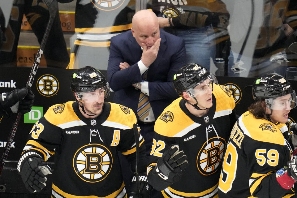 Boston Bruins head coach Jim Montgomery watches from the bench during the third period of Game 5 in the first round of the NHL hockey playoffs, Wednesday, April 26, 2023, in Boston. (AP Photo/Charles Krupa)