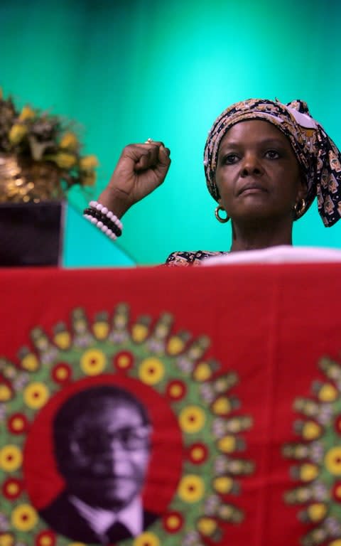 Grace Mugabe, shown here in October 2014, returned home from South Africa - Credit: JEKESAI NJIKIZANA/AFP/Getty Images