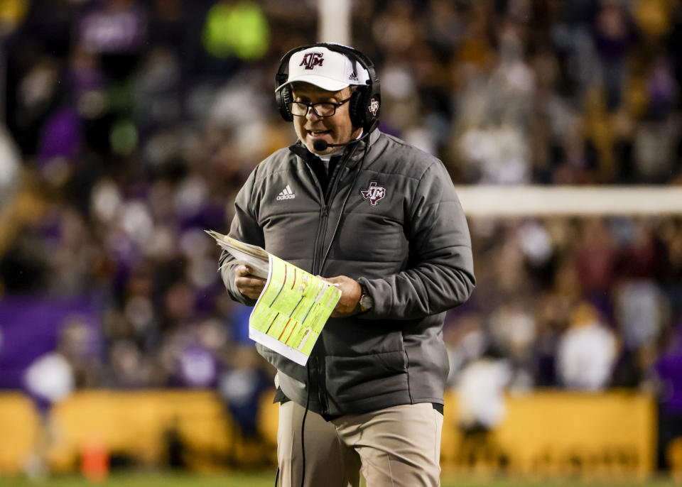 Texas A&M head coach Jimbo Fisher walks the sideline during the second quarter of an NCAA college football game against LSU in Baton Rouge, La., Saturday, Nov. 27, 2021. (AP Photo/Derick Hingle)