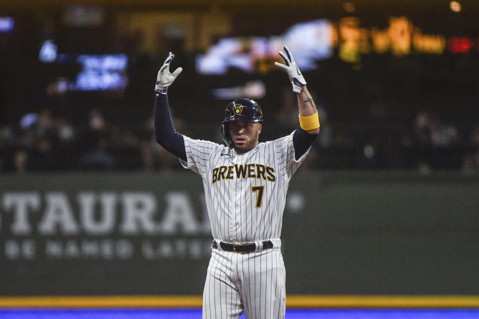 Milwaukee Brewers Victor Caratini celebrates a two-run double during the sixth inning of the team's baseball game against the Colorado Rockies on Saturday, July 23, 2022, in Milwaukee. (AP Photo/Kenny Yoo)