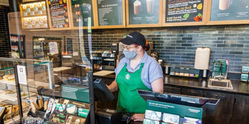 Starbucks Coffee shop, cashier wearing face mask