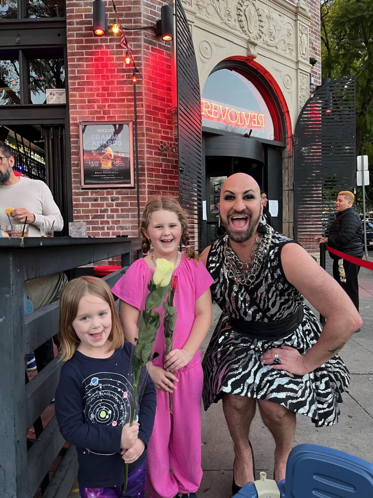 Siena (center) and her 4-year-old sister Riley pose with WeHo drag queen Billy Francesca. (Photo courtesy: Jen Levin) 