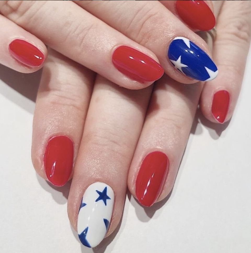 <p>Step up your classic red mani by adding blue and white stars to your accent nails, giving them that extra "Wow!" factor.</p><p><a class="link " href="https://www.amazon.com/OPI-Nail-Lacquer-Big-Apple/dp/B0034E103K/?tag=syn-yahoo-20&ascsubtag=%5Bartid%7C10072.g.27727694%5Bsrc%7Cyahoo-us" rel="nofollow noopener" target="_blank" data-ylk="slk:SHOP POLISH">SHOP POLISH</a> </p>