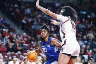 Hampton forward Nylah Young, left, drives to the basket against South Carolina center Kamilla Cardoso during the first quarter of an NCAA college basketball game in Columbia, S.C., Sunday, Nov. 27, 2022. (AP Photo/Nell Redmond)