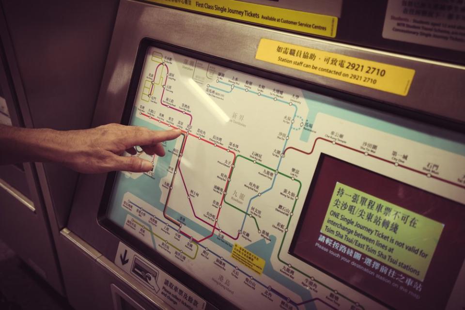 person buying ticket at the Tokyo Railway and Train Network