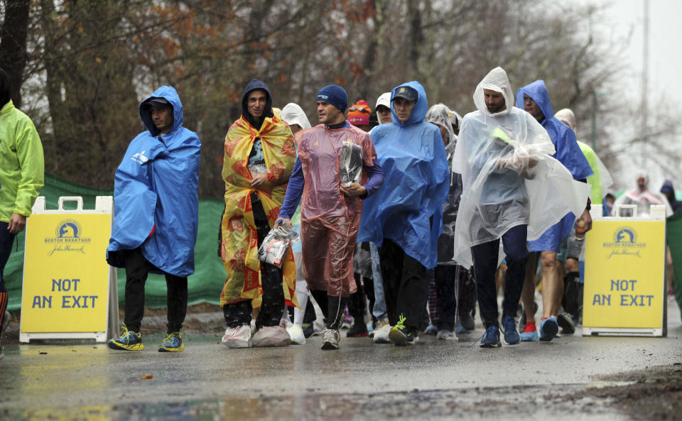 Runners arrive at the athletes village prior to the start of the123rd Boston Marathon on Monday, April 15, 2019, in Hopkinton, Mass. (AP Photo/Stew Milne)