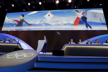 Denis Ten of Kazakhstan delivers a speech during Almaty's 2022 Olympic Winter Games bid presentation at the 128th International Olympic Committee (IOC) session in Kuala Lumpur, Malaysia, Friday, July, 31, 2015. (AP Photo/Vincent Thian, Pool)