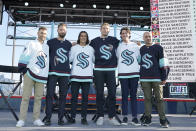 Seattle Kraken NHL hockey players Jordan Eberle, Chris Dreidger, Brandon Tanev, Jamie Oleksiak, Hadyn Fluery and Mark Giordano, from left, pose for a photo Wednesday, July 21, 2021, after being introduced during the Kraken's expansion draft event in Seattle. (AP Photo/Ted S. Warren)