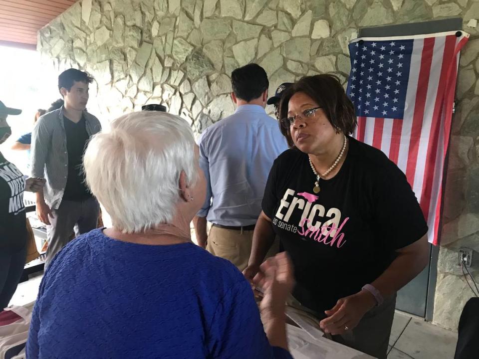 Former state Sen. Erica Smith, who ran unsuccessfully for the Democratic nomination for the Senate in 2020 and is running again next year, speaks with a member of the audience after a candidate forum in Holly Springs on Monday, July 12, 2021.