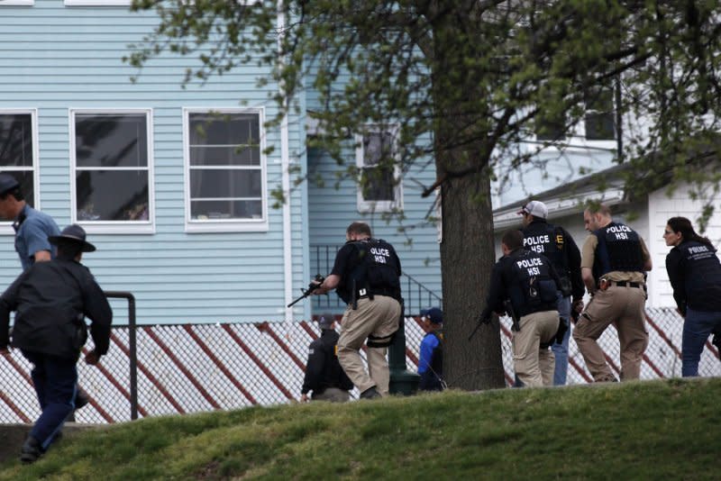 Police surround a house and a boat where suspected bomber of the Boston Marathon, Dzhokhar Tsarnaev, 19, is holed up on the run near Franklin Street in Watertown, Mass., on April 19, 2013. Tsarnaev was apprehended hiding under a tarp in a boat. File Photo by Matt Healey/UPI