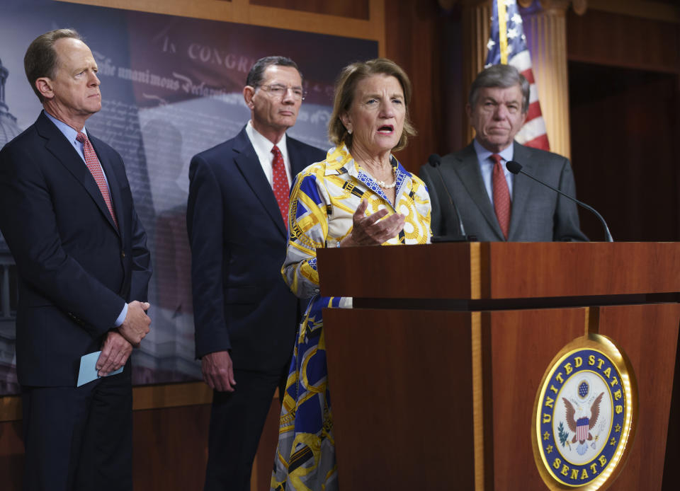 In this photo taken Thursday, May 27, 2021, Sen. Shelley Moore Capito, R-W.Va., the GOP's lead negotiator on a counteroffer to President Joe Biden's infrastructure plan, speaks at a news conference as she is joined by, from left, Sen. Pat Toomey, R-Pa., Sen. John Barrasso, R-Wyo., chairman of the Senate Republican Conference, and Sen. Roy Blunt, R-Mo., at the Capitol in Washington. (AP Photo/J. Scott Applewhite)