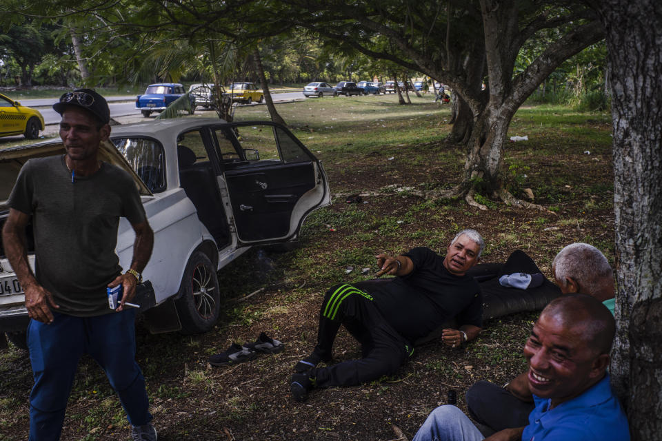 People wait in line to be able to refuel their cars in Havana, Cuba, Monday, April 24, 2023. Cuba’s capital has been restricting fuel sales, threatening to further weaken an economy reeling from power blackouts and rampant inflation. (AP Photo/Ramon Espinosa)