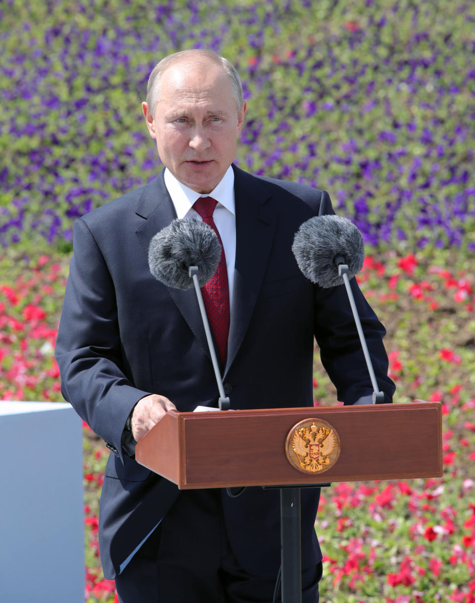 Russian President Vladimir Putin speaks during a ceremony of handing Gold Stars medals to heroes of labor marking the Day of Russia holiday in Moscow, Russia, on Friday, June 12, 2020. The ceremony marked the first big public event Putin attended since announcing a nationwide lockdown more than two months ago. (Mikhail Klimentyev, Sputnik, Kremlin Pool Photo via AP)