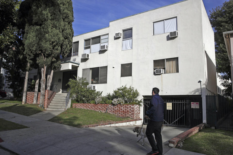 FILE - This Jan. 8, 2019 file photo shows the building housing the apartment of Ed Buck in West Hollywood, Calif., following the death of a man the previous day. It took more than two years from the first overdose death in political donor Ed Buck's apartment until his arrest this month. In the time in between, another man died in the West Hollywood home, another had a close brush with death and several others reporting harrowing encounters with the gay white man who preyed on young black men to satisfy a drug-fueled sexual fetish. Activists who pushed for Buck's arrest wonder why it took so long to lock him up. (AP Photo/Jae C. Hong, File)