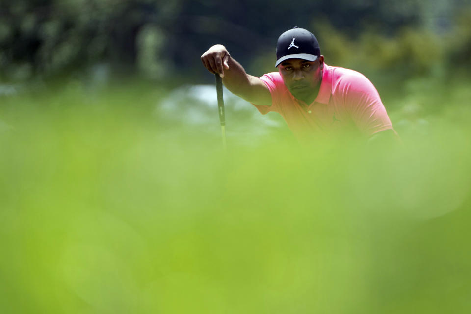 Harold Varner III of RangeGoats GC lines up a putt on the first green during the second round of LIV Golf tournament at The Greenbrier, Saturday, Aug. 5, 2023, in White Sulfur Springs, W.Va. (Photo by Charles Laberge/LIV Golf via AP)