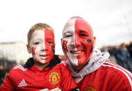 <p>United fans prooudly show their colours </p>