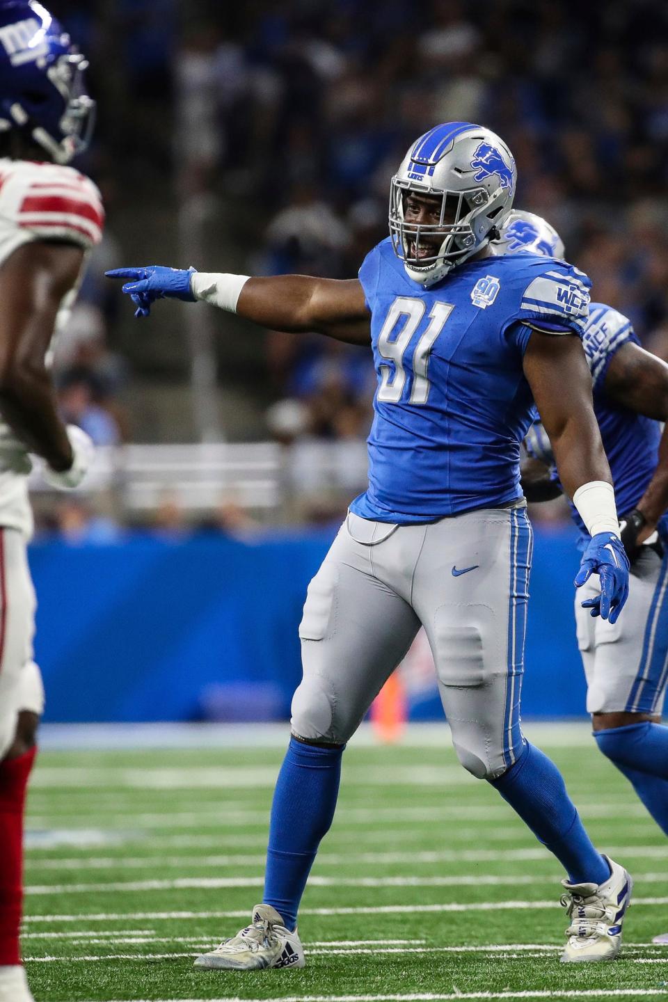 Detroit Lions defensive end Levi Onwuzurike (91) celebrates a tackle against the New York Giants during the first half of a preseason game at Ford Field in Detroit on Friday, Aug. 11, 2023.